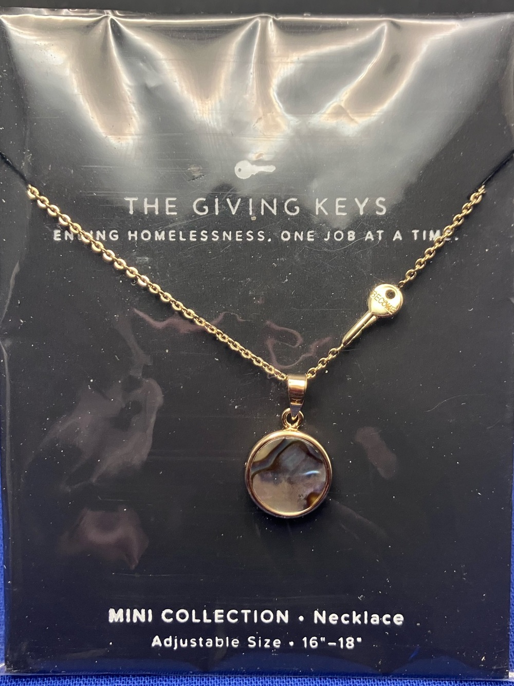 The Giving Keys Gold Round Pendant Necklace with Key Accent